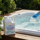 Poppits Pool & Spa Complete from a 5L container into a clear hot tub to balance and clarify the water